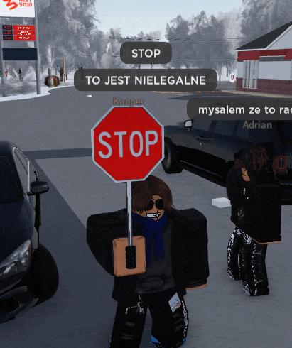 a stop sign is being held in front of a car
