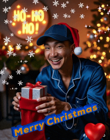 a man wearing a santa hat is holding a gift in front of a sign that says ho ho ho