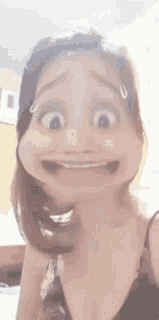 a woman is making a funny face with her mouth open and making a cartoon face .