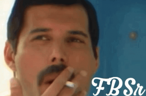 Freddie Mercury Nod GIF - Freddie Mercury Nod Smoking GIFs