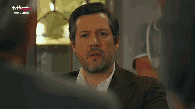 a man 's face is shown in a tv advertisement for tviflix