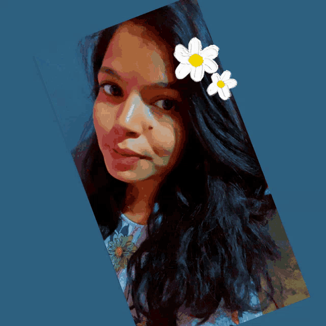 a woman with two white flowers in her hair looks at the camera