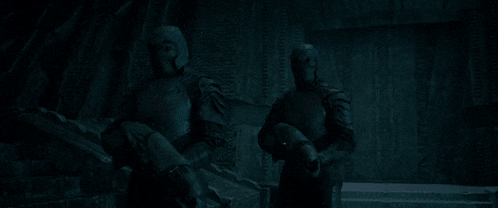 a group of soldiers are standing in a dark room with a sign that says " exit "