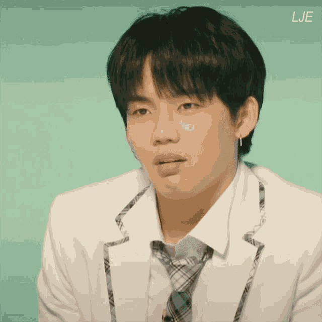 a close up of a person 's face with the word lje on the bottom right