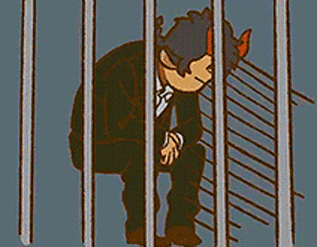 a man in a suit is sitting behind bars in a jail cell .