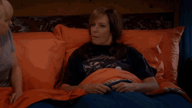 a woman is laying in bed with the words " i was kidding " written on the bottom
