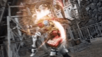a man in a superhero costume is being attacked by a monster in a video game .