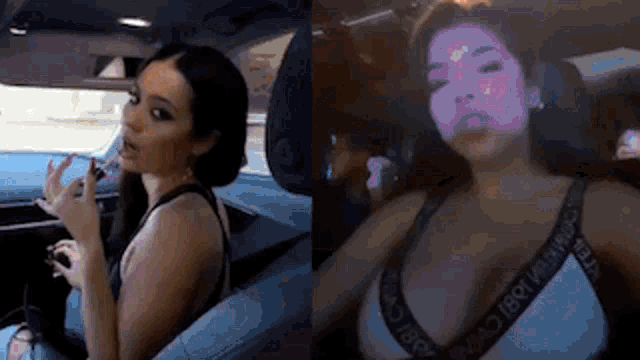 two women are sitting in the back seat of a car . one of the women is wearing a bra .