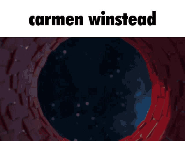 a poster for carmen winstead shows a woman hanging upside down in a tunnel