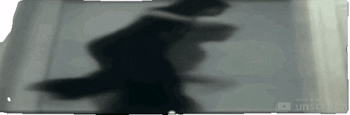 a shadow of a person is on a screen that says made with unscreen on the bottom