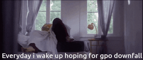 a person laying on a bed with the words " everyday i wake up hoping for gpo downfall "