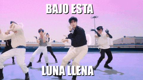 a group of young men are dancing in front of a pink background that says " bajo esta luna llena "