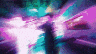 a blurry picture of a person in a room with purple lights