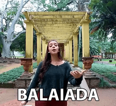 a woman in a green sweater stands in front of a pergola with the word balaiada written on the bottom
