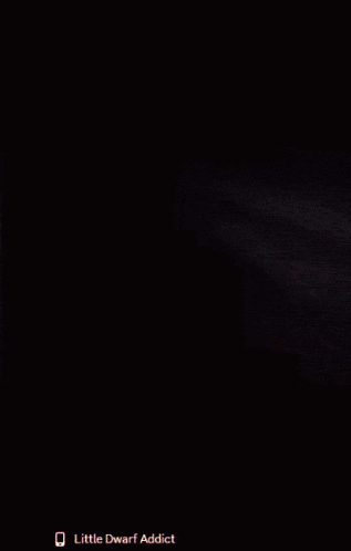 a close up of a person 's face with the words little dwarf addict on the bottom