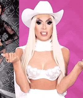a drag queen wearing a white cowboy hat and a white bra is giving the middle finger .