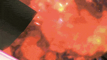 a close up of a red background with a lot of dots