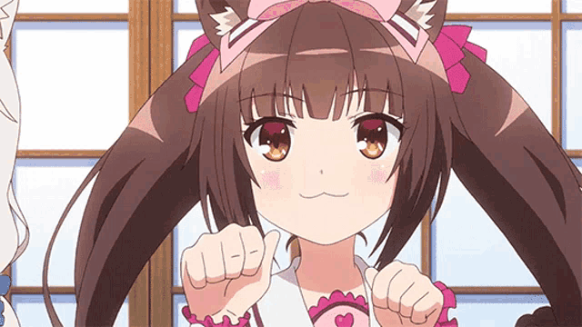 a girl with a cat ear headband is giving a thumbs up sign