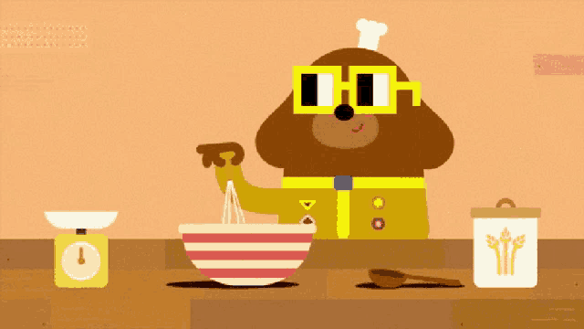 a cartoon dog wearing sunglasses and a chef 's hat is mixing ingredients in a bowl