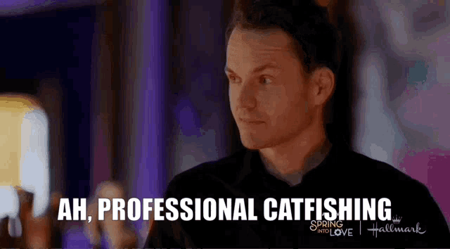 a man in a black shirt is talking about catfishing in a hallmark movie .