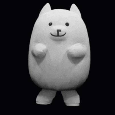 a white stuffed animal with the letter t on it