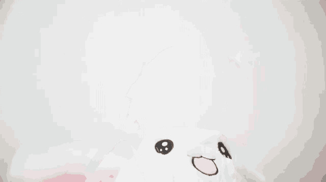 a young woman wearing a bunny hat with moving ears is smiling .