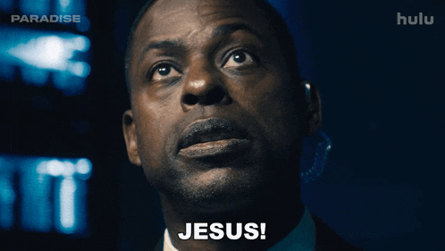 a man in a suit says jesus in front of a paradise logo