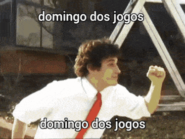 a man in a white shirt and red tie is running with the words domingo dos jogos above him