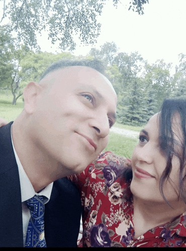 a man and a woman are posing for a picture together
