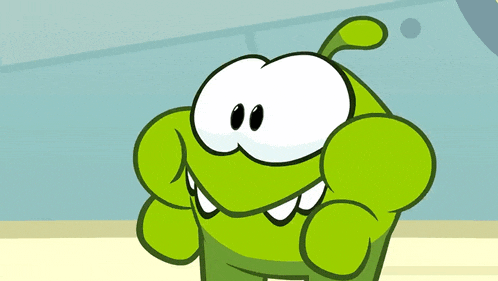 a green cartoon character with big eyes and teeth looks at the camera
