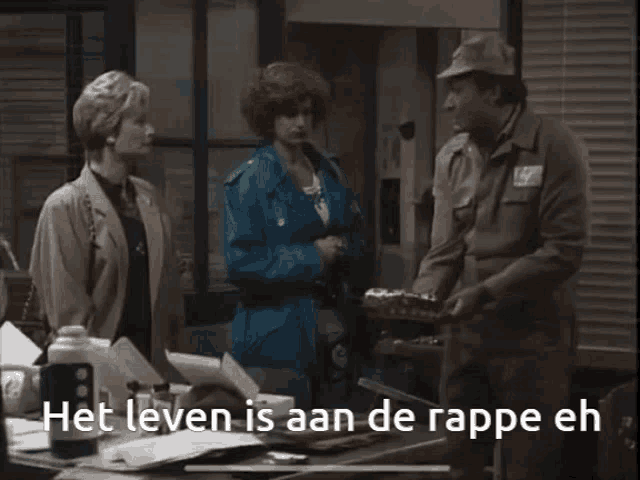a man and two women are standing next to each other with the words het leven is aan de rapper eh in the corner