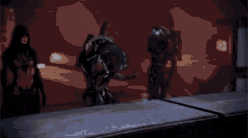 a group of people are standing next to each other in a dark room in a video game .