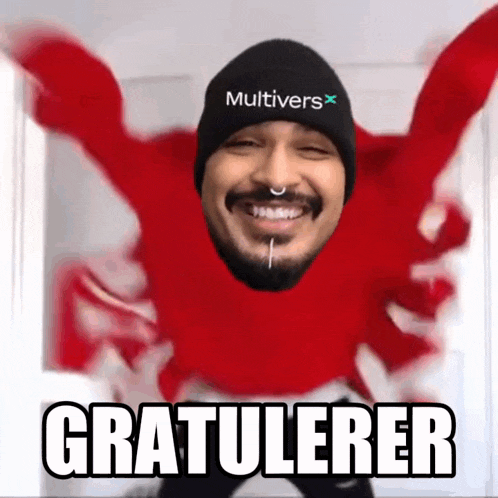 a man wearing a red sweater and a black beanie with the words gratulerer on it