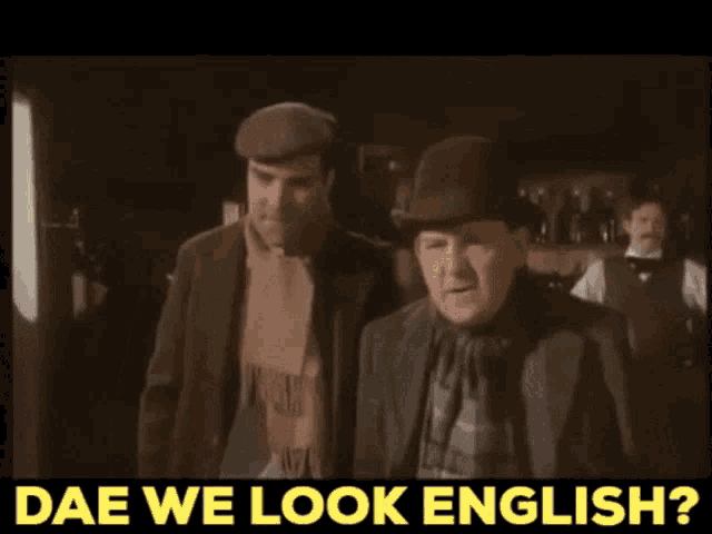 two men are standing next to each other with the words dae we look english below them