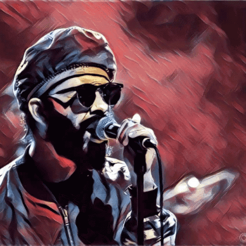 a man singing into a microphone with a red background