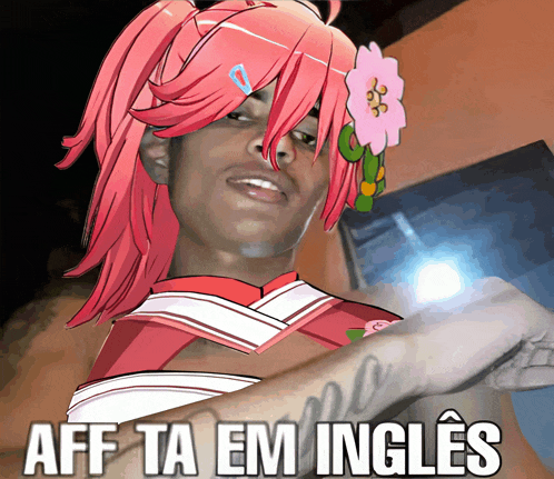 a man with pink hair and a flower in his hair has the words aff ta em ingles on his arm