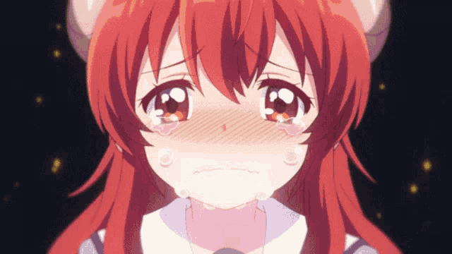 a girl with red hair is crying with tears running down her face