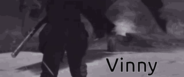 a black and white photo of a man with the name vinny
