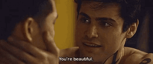two men are looking at each other and one of them is saying `` you 're beautiful . ''