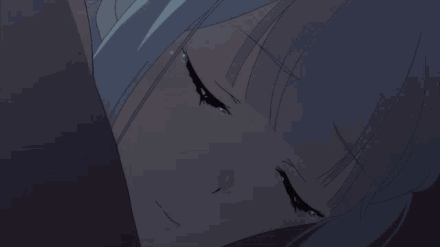 a close up of a girl 's face with tears coming out of her eyes