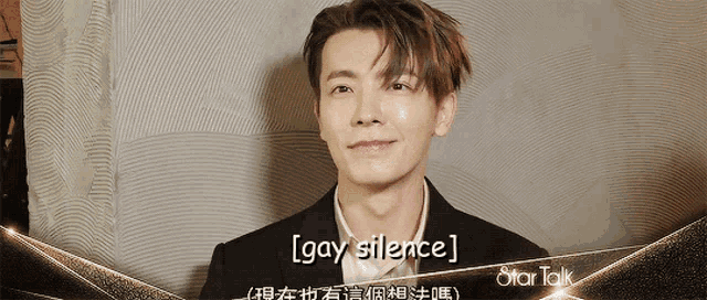 a man in a suit says gay silence on the screen