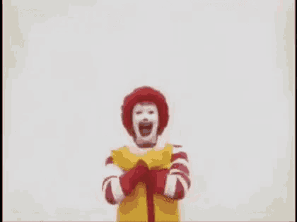 mcdonald 's ronald mcdonald is holding his arms up in the air in a painting .