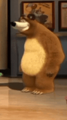 a cartoon bear is standing on a wooden floor in front of a wall .