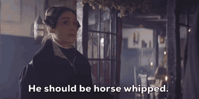 a woman says he should be horse whipped while standing in front of a building