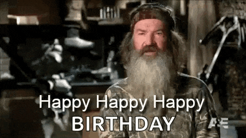 a man with a beard is wearing a camo shirt and a hat and says happy happy happy birthday .