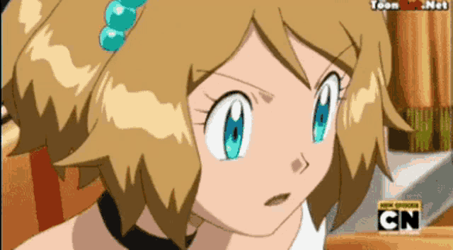 a close up of a girl 's face with cn on the bottom right