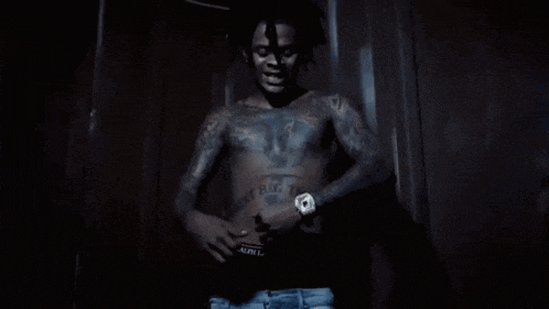 a shirtless man with tattoos on his arms and chest is wearing ralph lauren underwear
