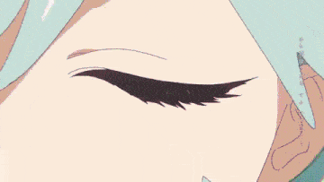 a close up of a person 's face with chinese writing