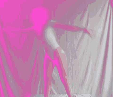 a blurry image of a person doing a yoga pose with a blue background