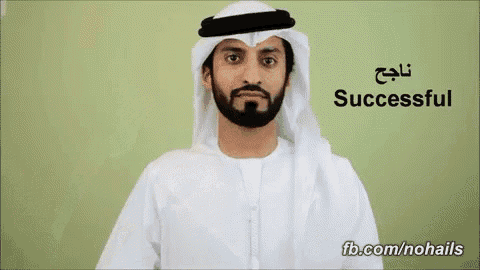 a man with a beard is wearing a white robe with the word successful written on it